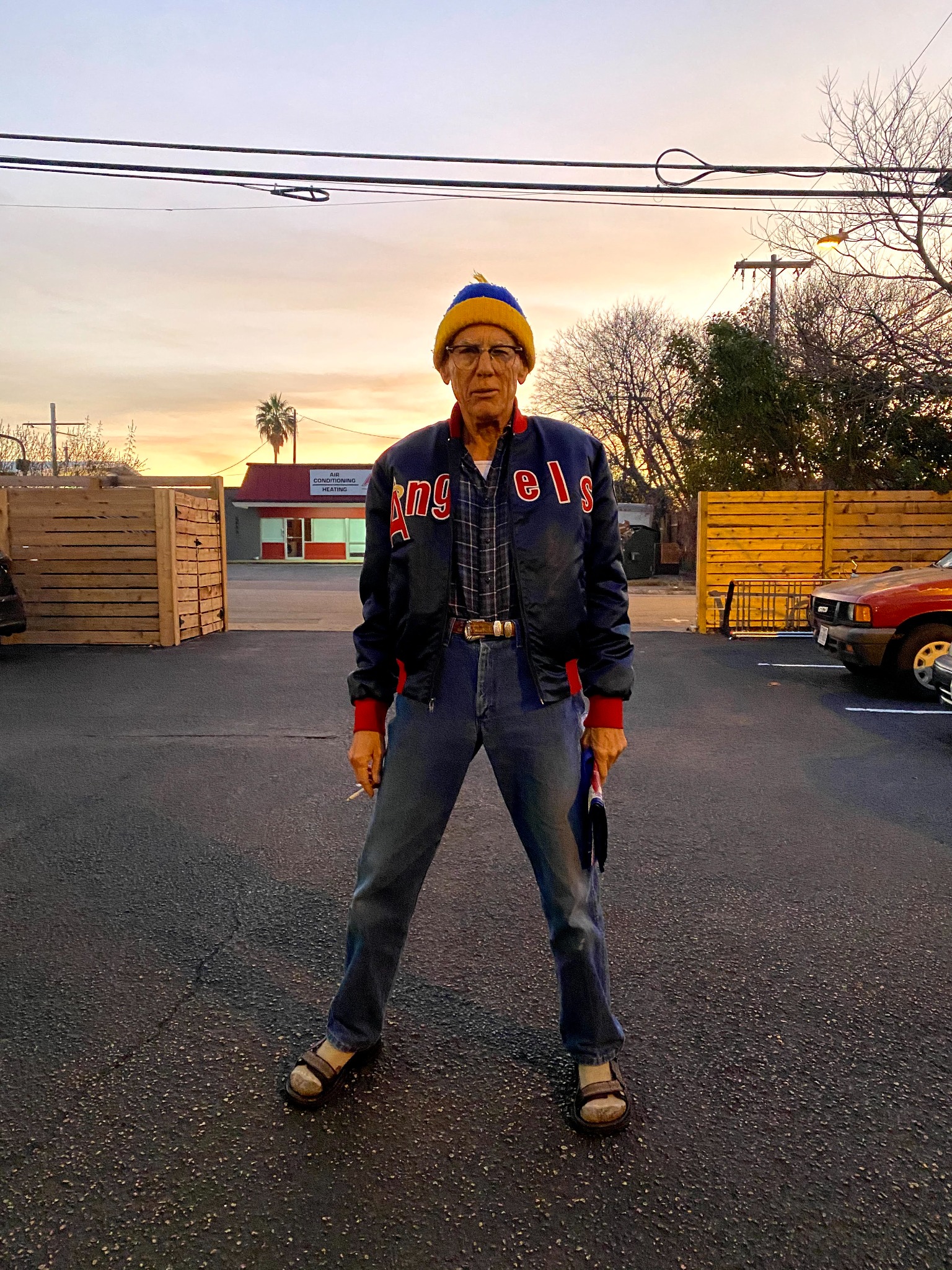 David standing in an Austin parking lot at sunset, photographed by Kaan S. Barin