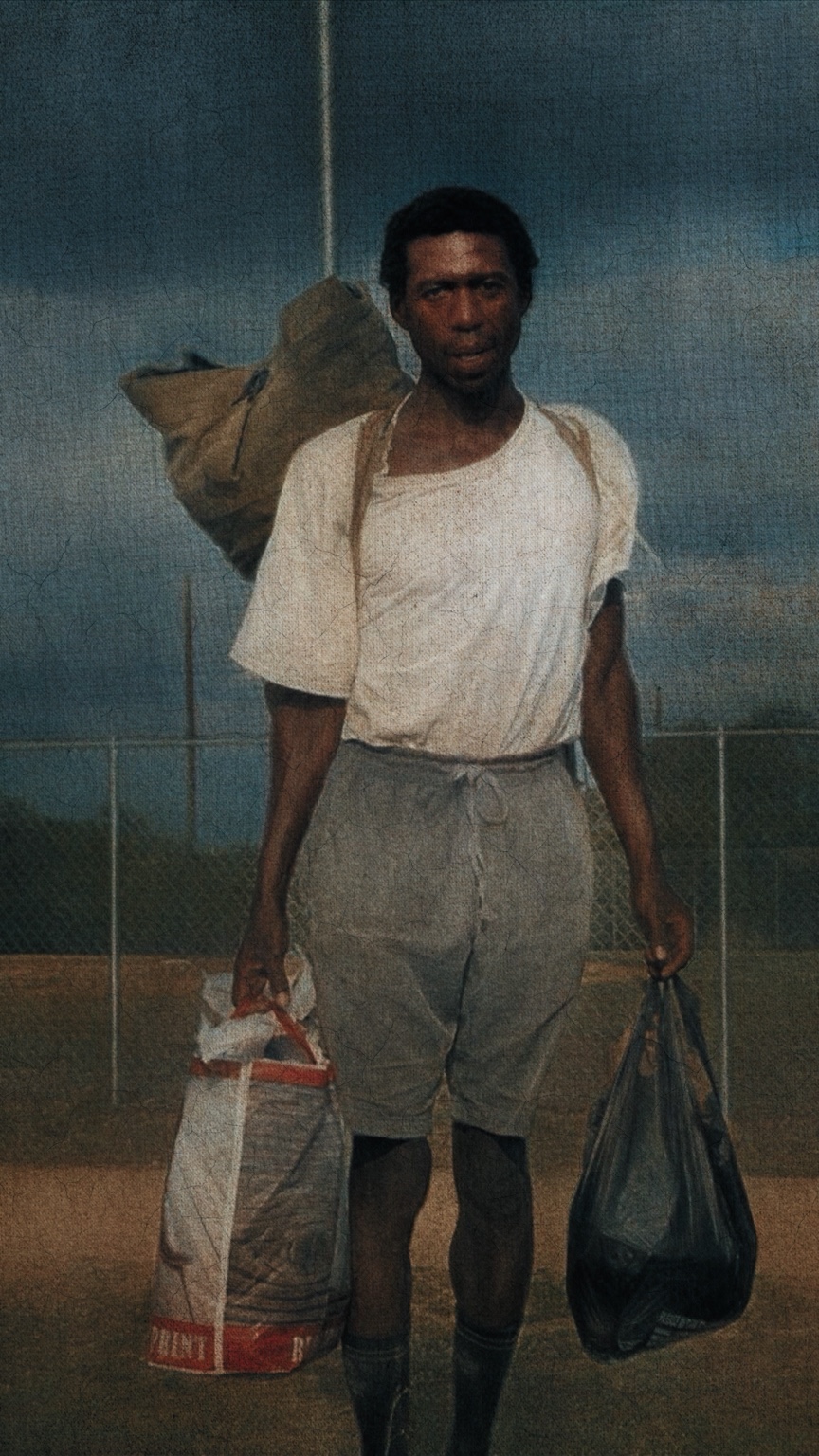 Portrait of a traveler carrying bags at dusk